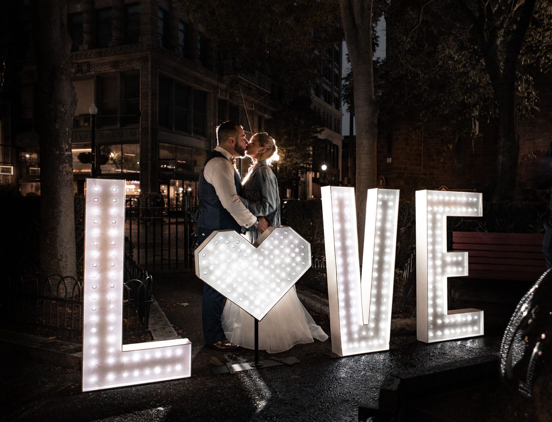 Marquee letter display at a New England wedding with pink uplighting