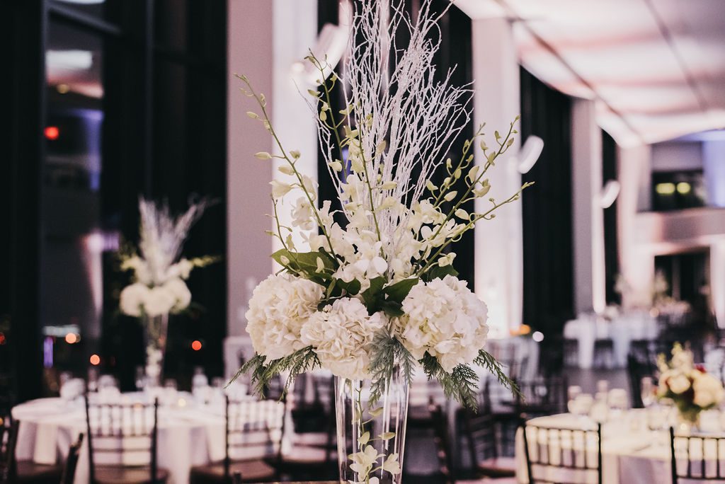 Pin spot lighting on centerpieces at a State Room Boston wedding
