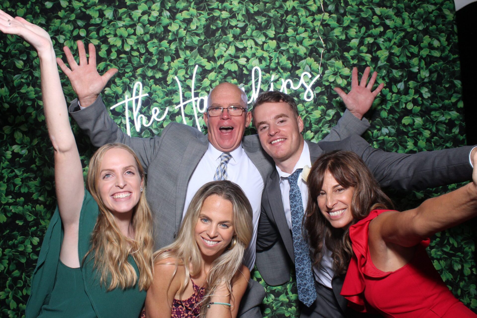 Hedge wall LED sign backdrop at a Black Diamond photo booth at a Boston wedding