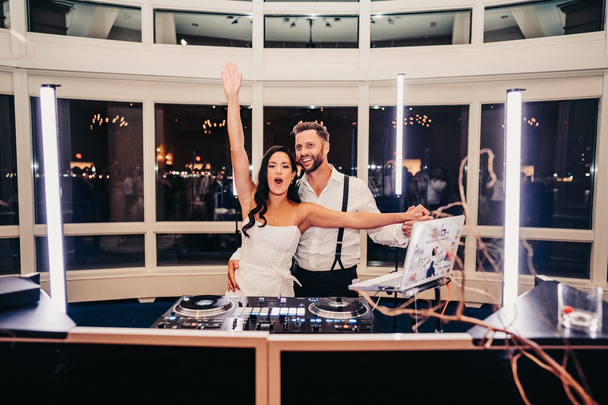 Bride and groom dancing in colorful pixel tube lighting at a New England wedding reception