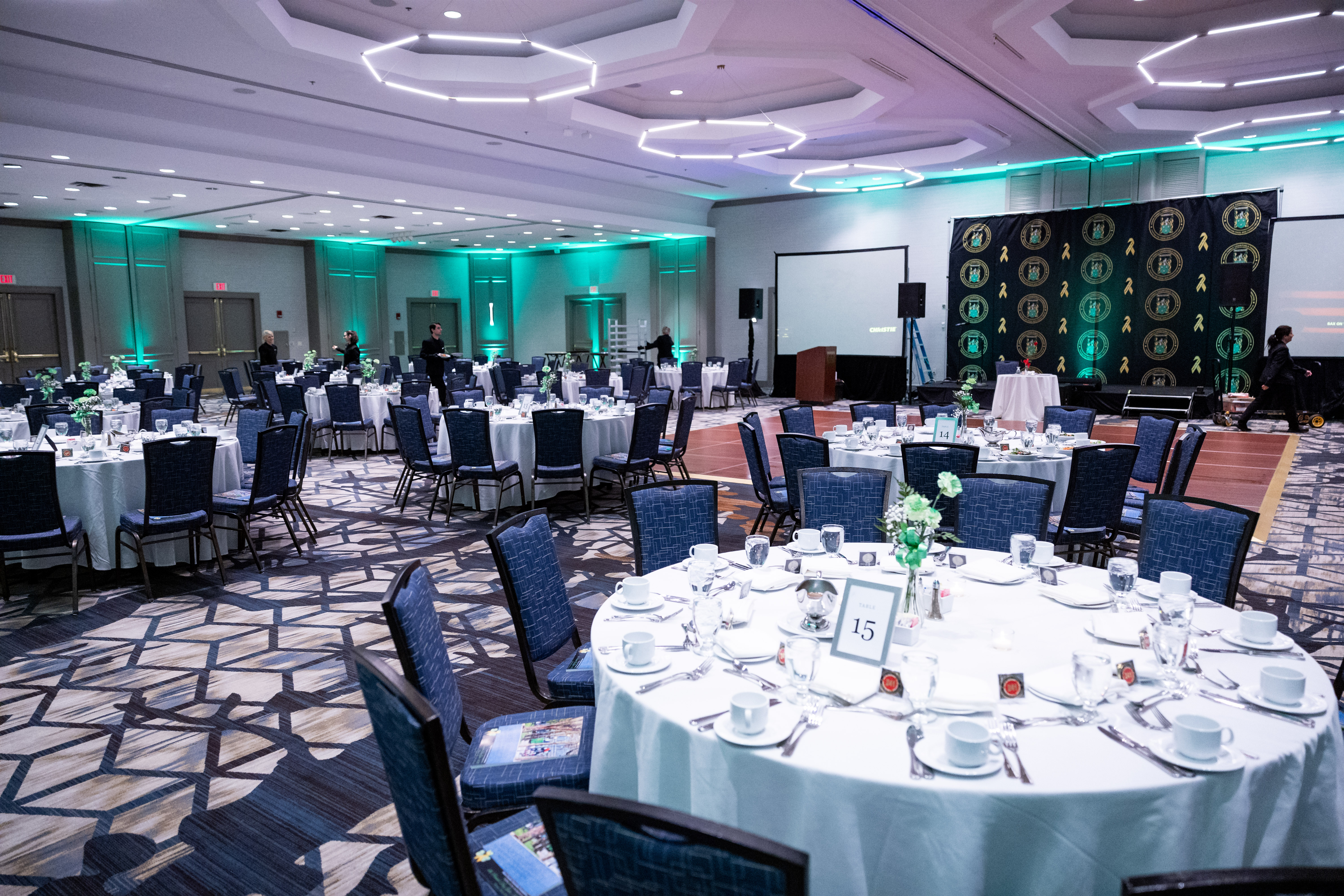 Corporate gala with professional stage lighting and screen design