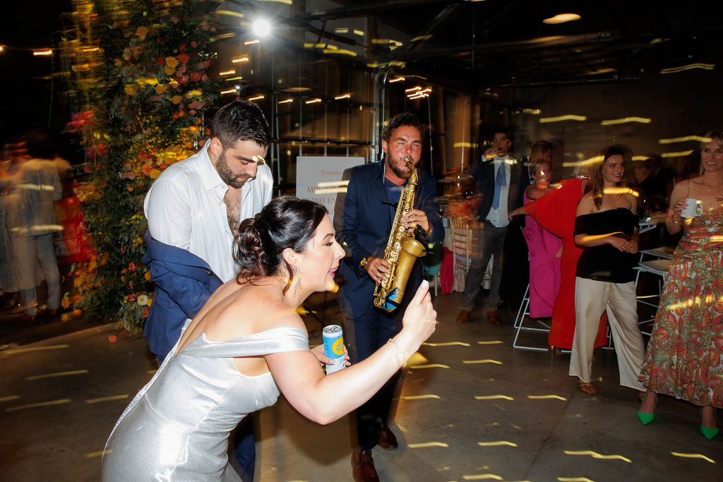 DJ and live saxophone performance at elegant New England wedding reception, guests dancing